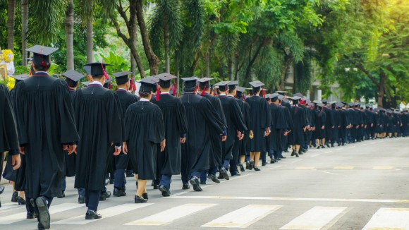 Graduates walking together after a ceremony